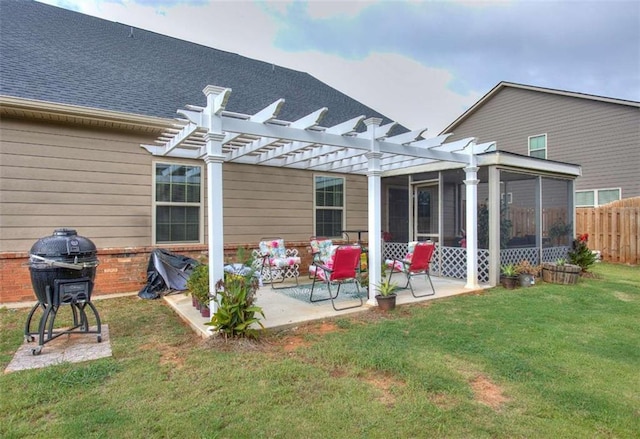 back of property with a sunroom, a yard, a pergola, and a patio