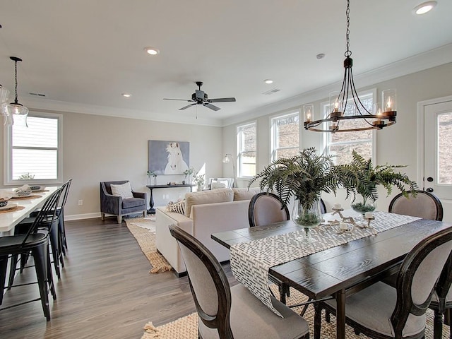 dining area featuring ornamental molding, hardwood / wood-style floors, and ceiling fan