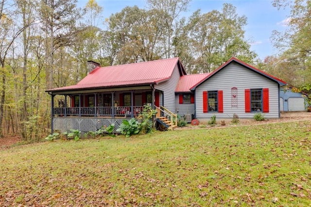 view of front of home with covered porch and a front lawn