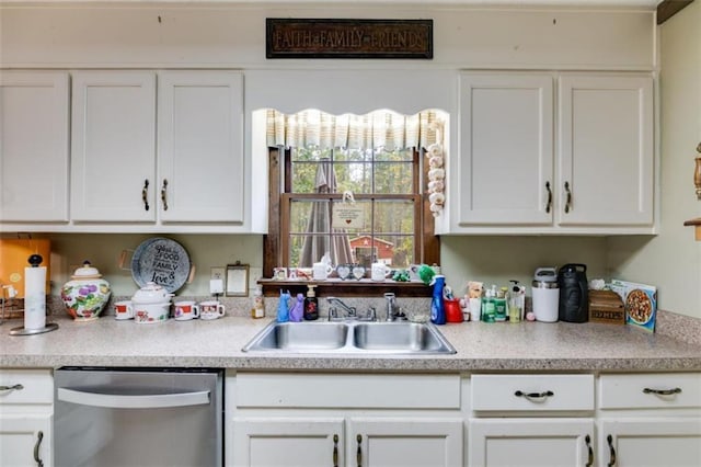 kitchen with white cabinetry, stainless steel dishwasher, and sink