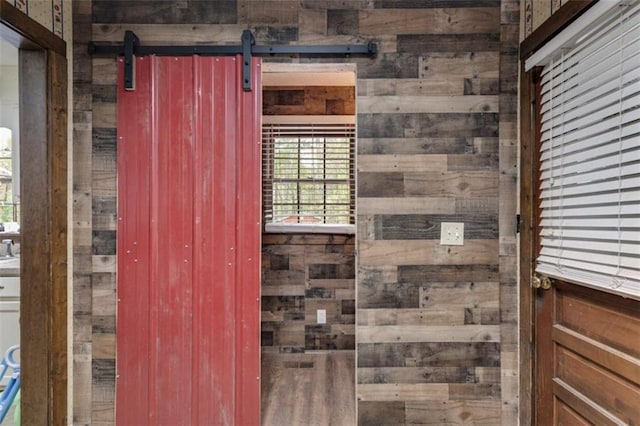 bathroom featuring wood walls