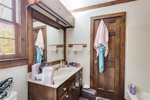 bathroom with vanity and toilet