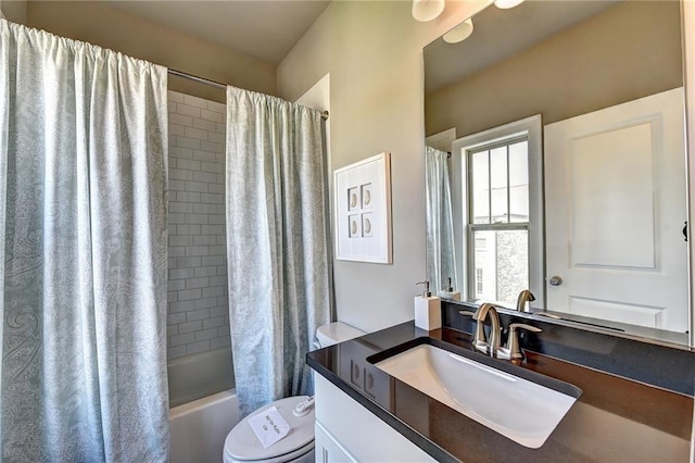 full bath with toilet, vanity, and shower / bath combination with curtain