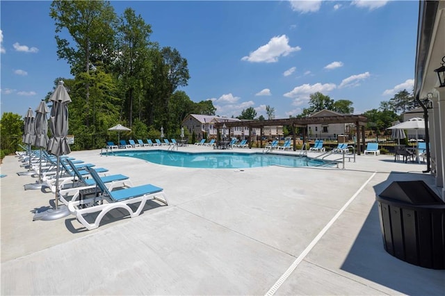 pool with fence and a patio