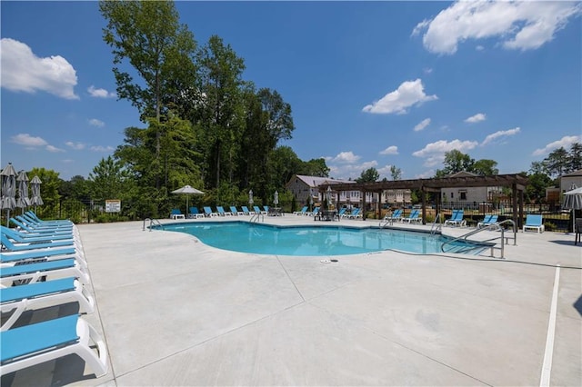 pool featuring a patio and fence