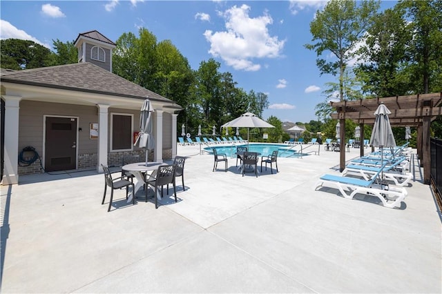 pool featuring a patio and a pergola