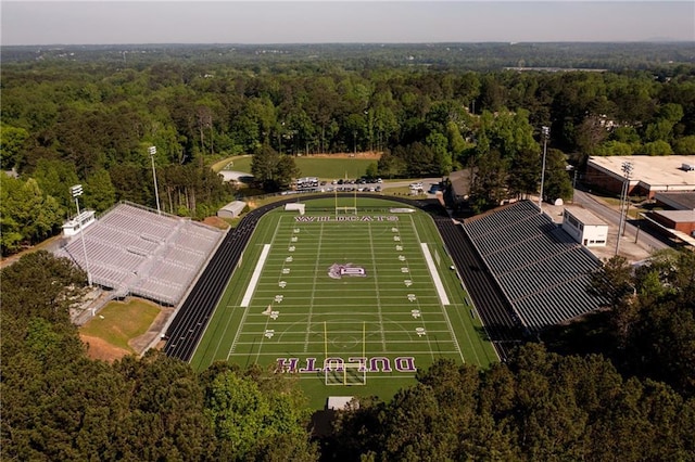 drone / aerial view featuring a wooded view