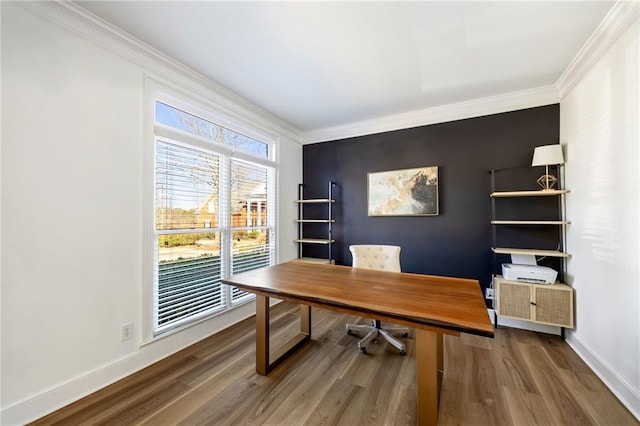 office space with ornamental molding, wood finished floors, and baseboards