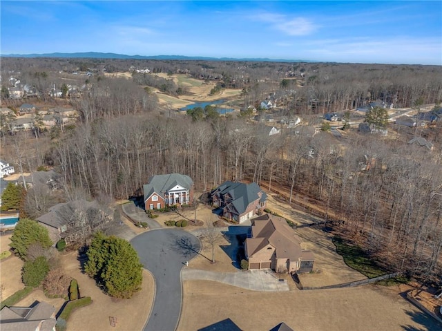 aerial view of property's location featuring a nearby body of water