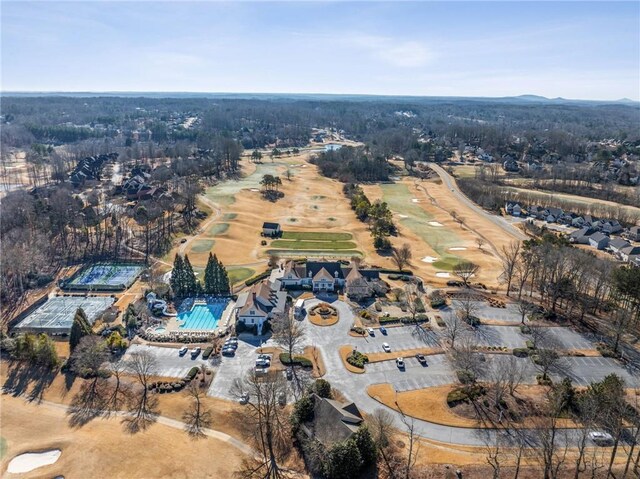 bird's eye view of a golf club and a water and mountain view