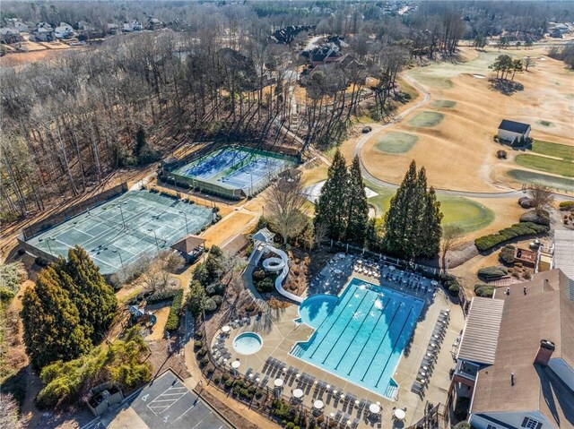 view of property location with a pool area