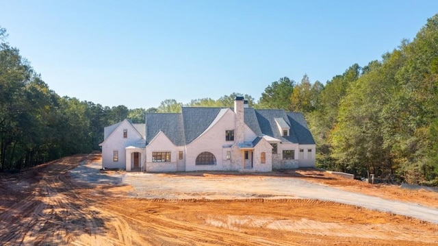 615 Hickory Flt, Milton, GA 30004 - view of front facade with a chimney and stone siding