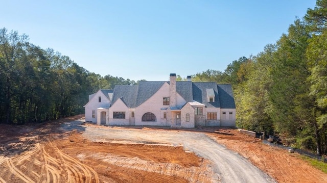 615 Hickory Flt, Milton, GA 30004 - view of front of home featuring a chimney and stone siding