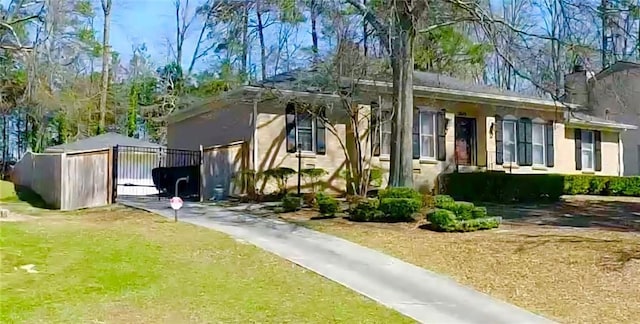 3845 Pebble Beach Dr, Atlanta, GA 30349 - view of front of house featuring an outbuilding and driveway