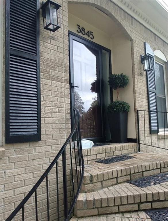 3845 Pebble Beach Dr, Atlanta, GA 30349 - property entrance with brick siding