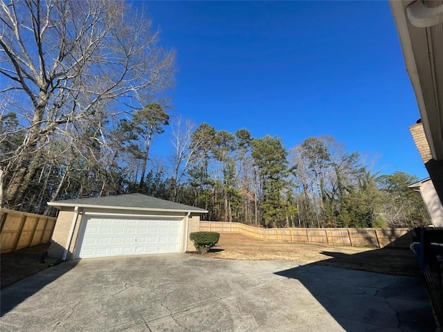 3845 Pebble Beach Dr, Atlanta, GA 30349 - fenced backyard featuring an outdoor structure and a detached garage
