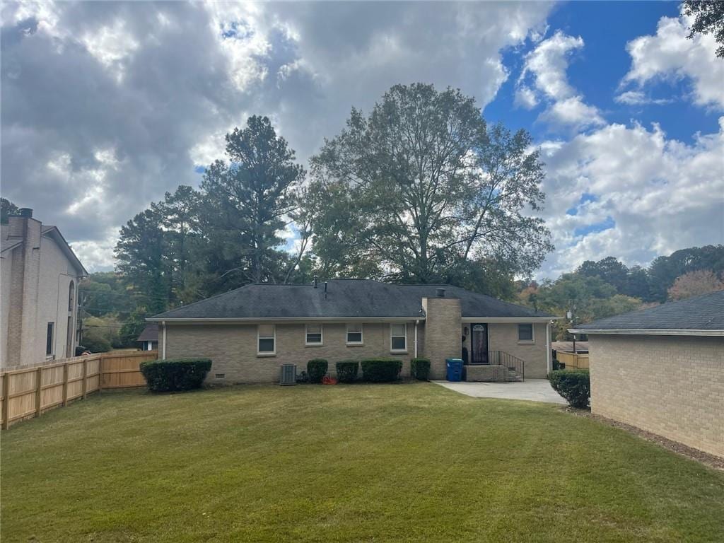 3845 Pebble Beach Dr, Atlanta, GA 30349 - rear view of property with a patio and brick siding