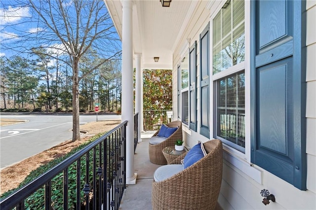 balcony featuring a porch and a sunroom