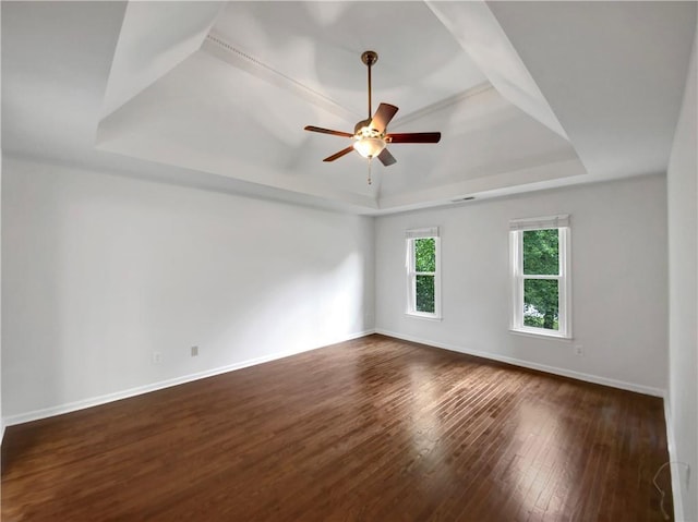 110 Wyngate Way, Fayetteville, GA 30215 - empty room with a raised ceiling, dark wood-style flooring, and a ceiling fan