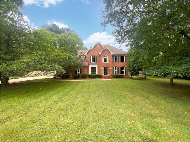 110 Wyngate Way, Fayetteville, GA 30215 - colonial-style house featuring brick siding and a front lawn