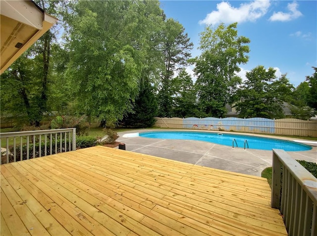 110 Wyngate Way, Fayetteville, GA 30215 - view of swimming pool with a fenced backyard, a wooden deck, and view of wooded area
