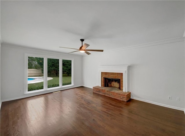 110 Wyngate Way, Fayetteville, GA 30215 - unfurnished living room with ceiling fan, wood finished floors, a brick fireplace, and crown molding
