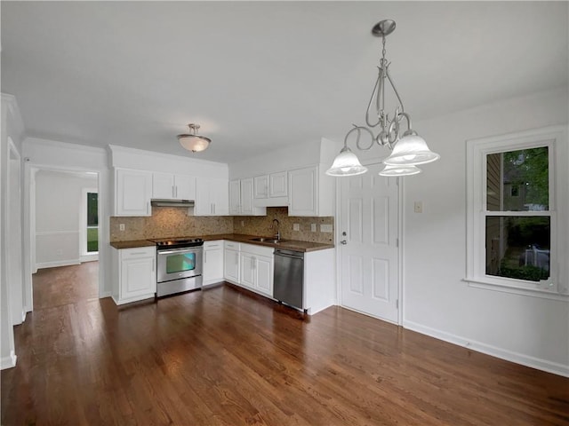 110 Wyngate Way, Fayetteville, GA 30215 - kitchen featuring stainless steel appliances, dark countertops, decorative backsplash, white cabinetry, and dark wood finished floors