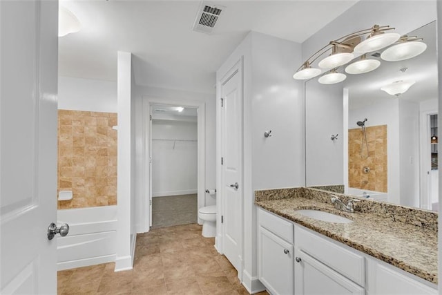 full bathroom featuring bathtub / shower combination, vanity, and toilet