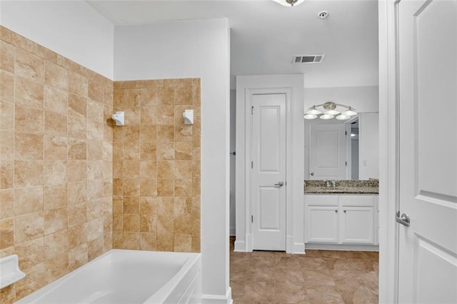 bathroom featuring vanity and shower / bath combination