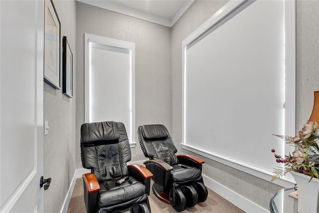 sitting room with carpet flooring and ornamental molding