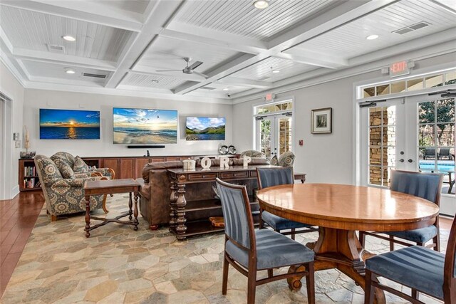 dining area featuring coffered ceiling, ceiling fan, beam ceiling, and french doors