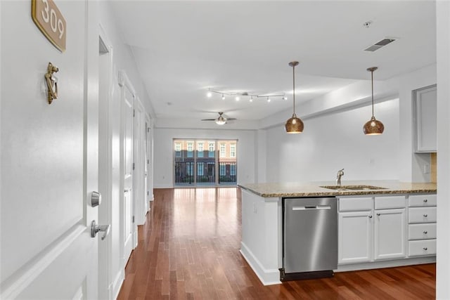 kitchen featuring pendant lighting, sink, stainless steel dishwasher, ceiling fan, and white cabinetry