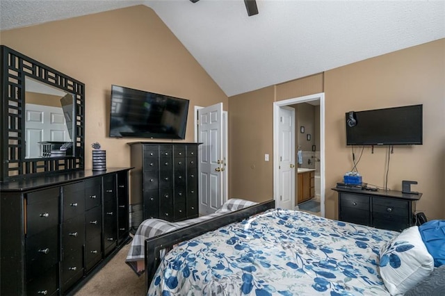 carpeted bedroom featuring ensuite bathroom, vaulted ceiling, and ceiling fan