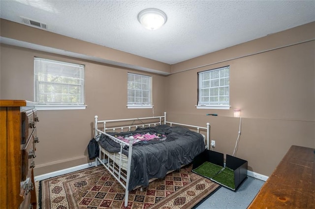 bedroom with a textured ceiling