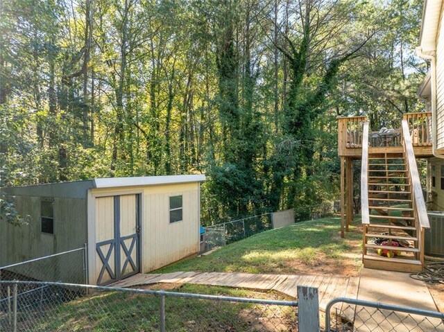 view of outbuilding featuring central air condition unit and a lawn