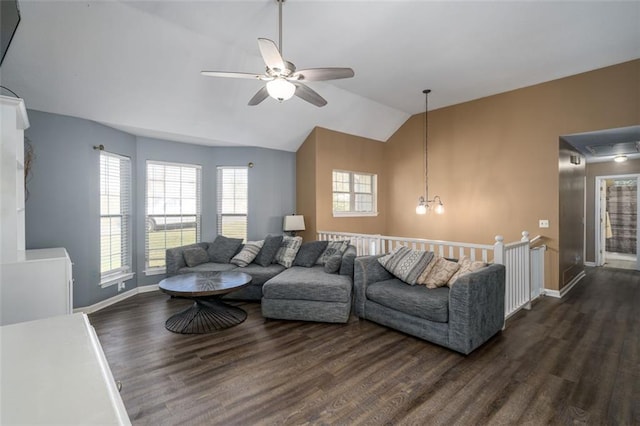 living room with dark wood-type flooring, vaulted ceiling, and ceiling fan with notable chandelier