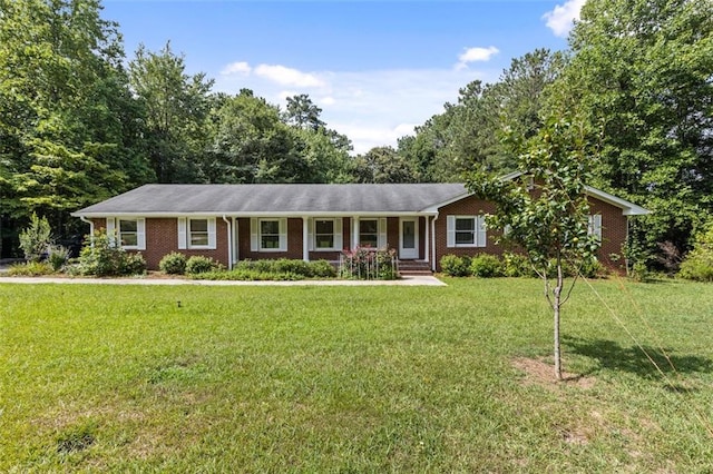 ranch-style home with a porch and a front lawn