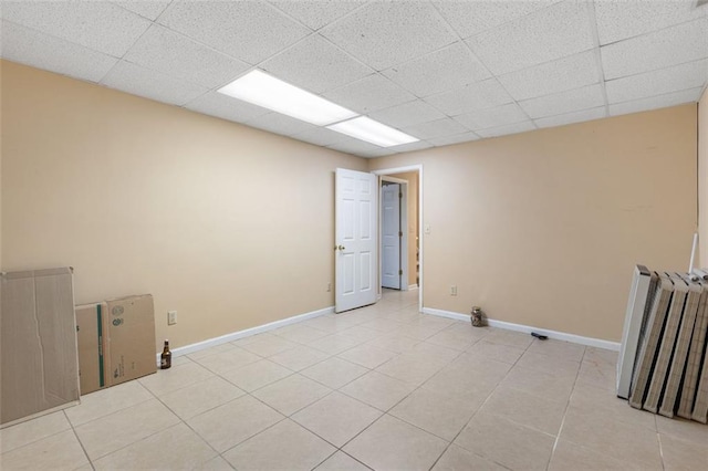 tiled spare room featuring radiator heating unit