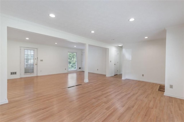 interior space featuring light hardwood / wood-style flooring and crown molding