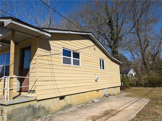 view of side of home featuring crawl space