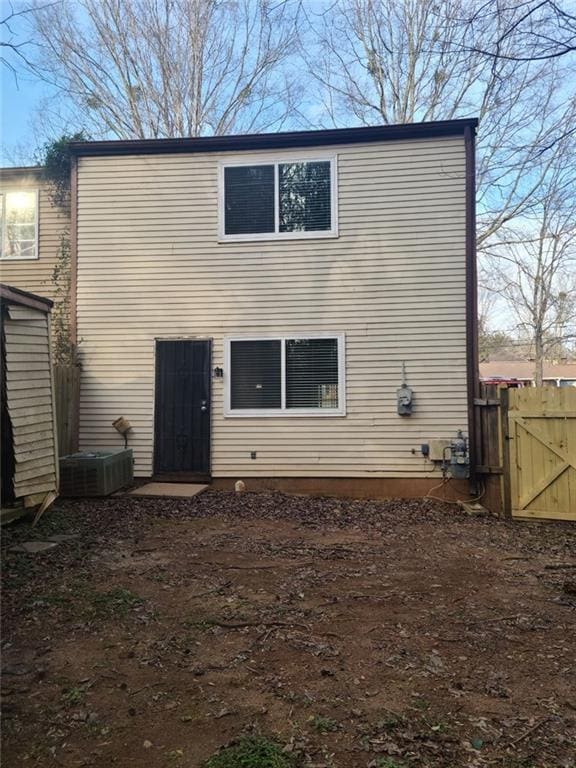 rear view of property with central air condition unit