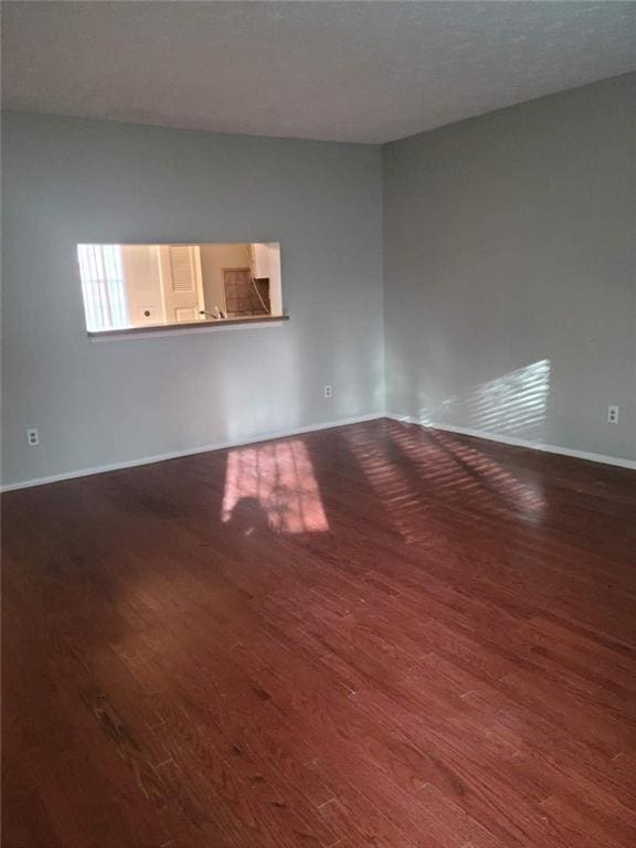 empty room featuring wood-type flooring