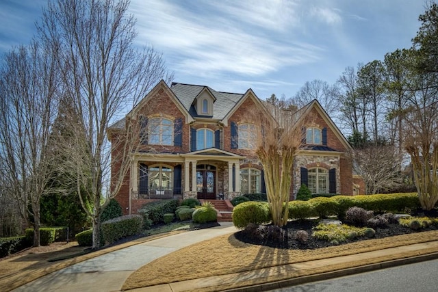 view of front of house featuring stone siding and brick siding