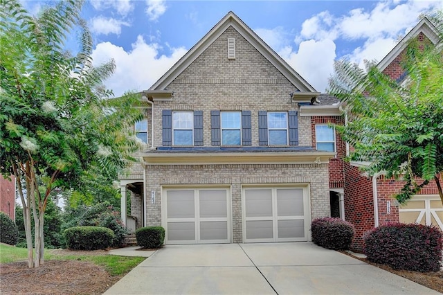 4165 Hammond Bridge Dr, Suwanee, GA 30024 - view of front facade featuring driveway, an attached garage, and brick siding
