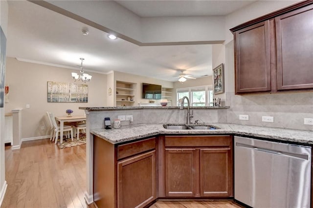 4165 Hammond Bridge Dr, Suwanee, GA 30024 - kitchen featuring stainless steel dishwasher, a peninsula, light stone countertops, and a chandelier