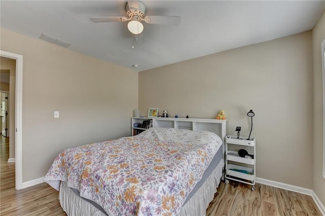 4165 Hammond Bridge Dr, Suwanee, GA 30024 - bedroom with light wood finished floors and a ceiling fan