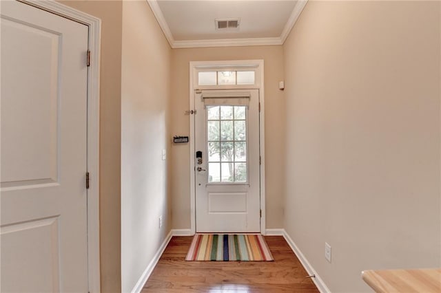 4165 Hammond Bridge Dr, Suwanee, GA 30024 - entryway featuring wood finished floors and crown molding