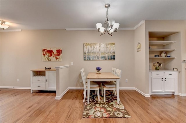 4165 Hammond Bridge Dr, Suwanee, GA 30024 - dining space featuring light wood-style floors, a chandelier, and crown molding