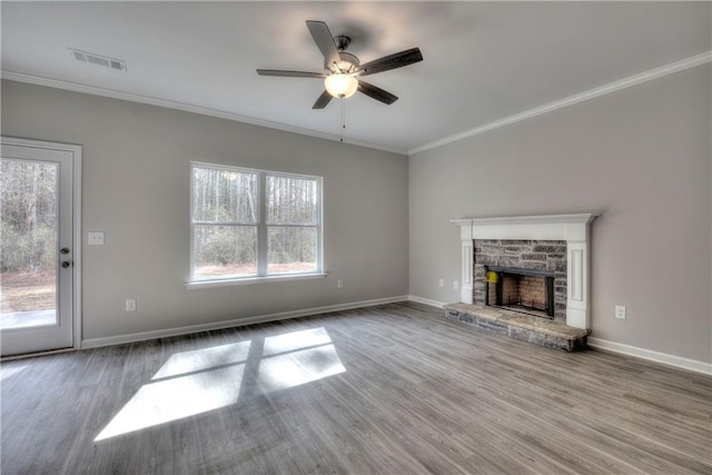 unfurnished living room with a fireplace, ceiling fan, wood-type flooring, and crown molding