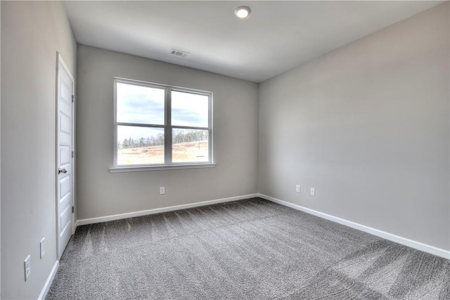 spare room featuring carpet flooring